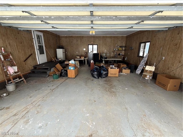 garage featuring wooden walls