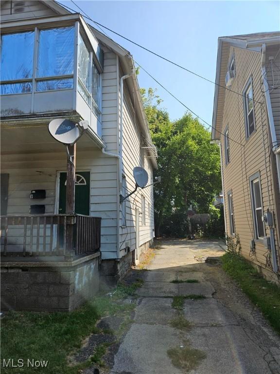 view of side of home with a porch