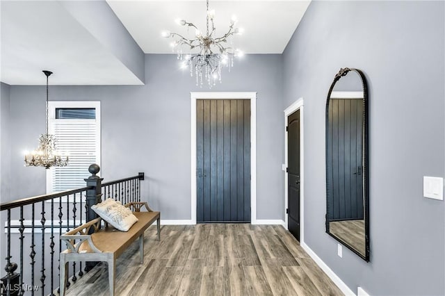 entrance foyer with a chandelier and hardwood / wood-style floors