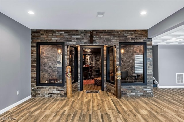 wine room with hardwood / wood-style floors