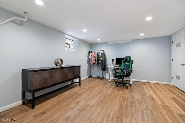office space with light hardwood / wood-style flooring