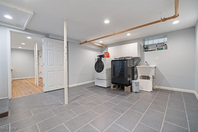 laundry room with cabinets and washer and dryer