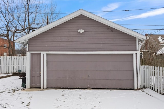 view of snow covered garage
