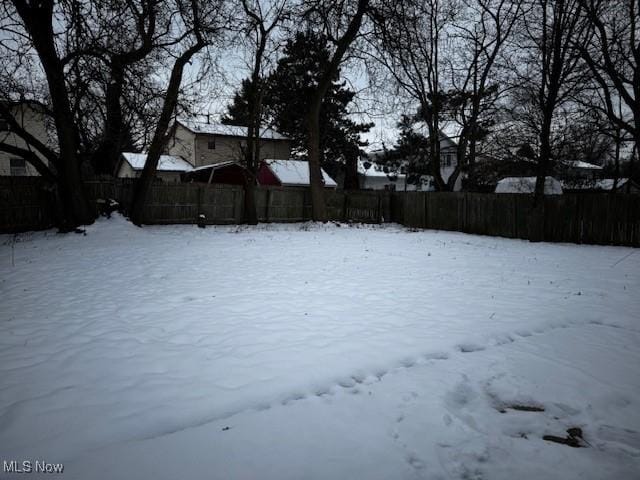 view of yard layered in snow