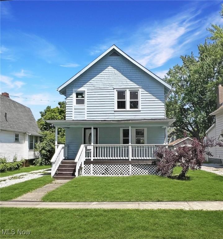 view of front of property with a front lawn and a porch