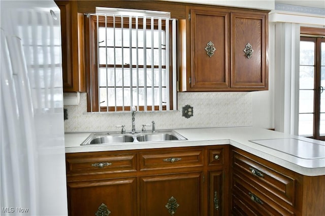 kitchen featuring kitchen peninsula and sink