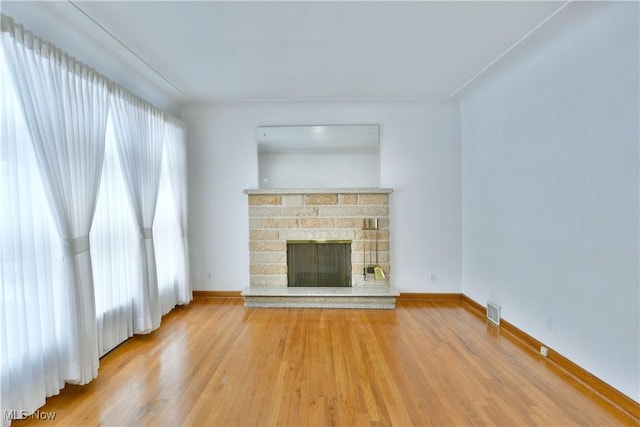 unfurnished living room with hardwood / wood-style flooring