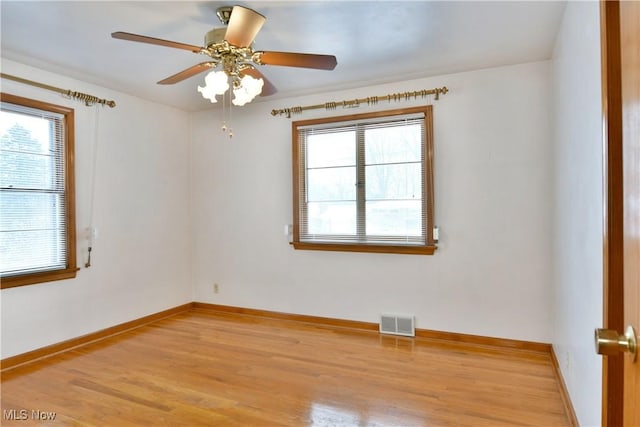 empty room featuring ceiling fan and light hardwood / wood-style flooring