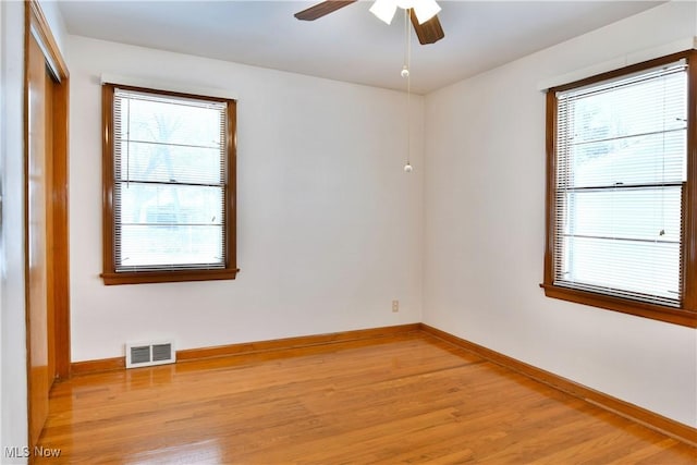 spare room with ceiling fan and light hardwood / wood-style flooring