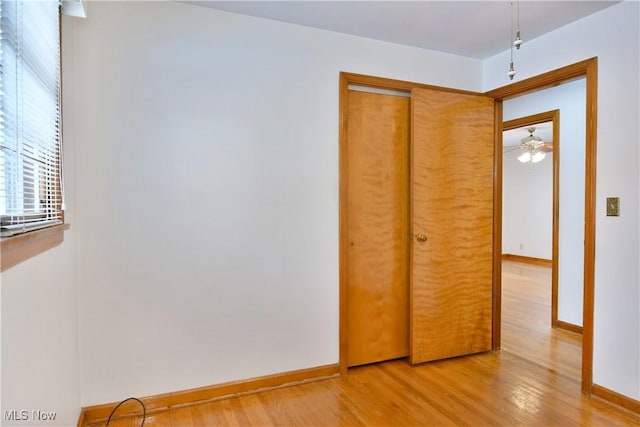 unfurnished bedroom with a closet and wood-type flooring