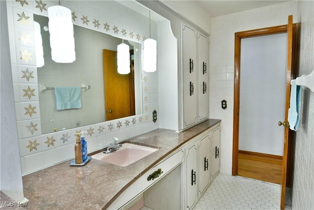 bathroom with tile patterned flooring and vanity