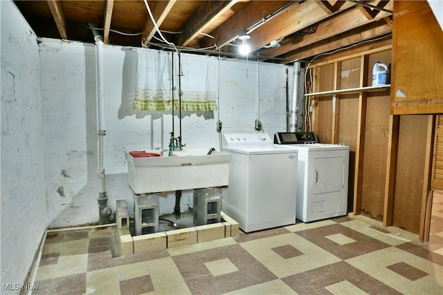 washroom featuring independent washer and dryer and sink