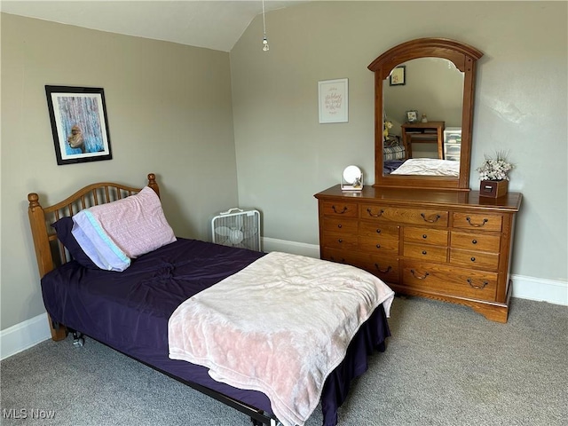 carpeted bedroom featuring lofted ceiling