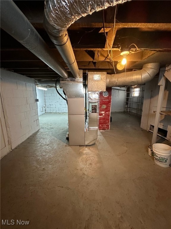 basement featuring heating unit