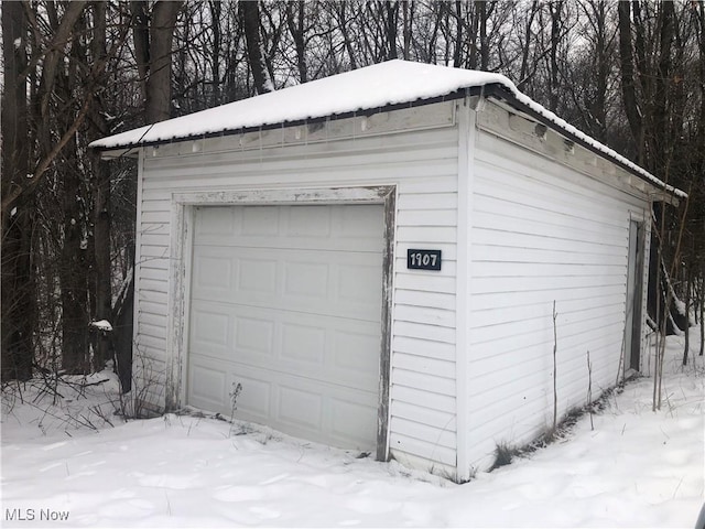 view of snow covered garage