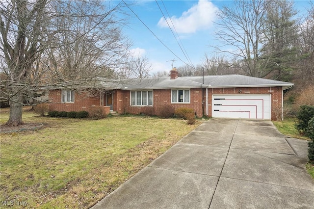 ranch-style home with a garage and a front lawn