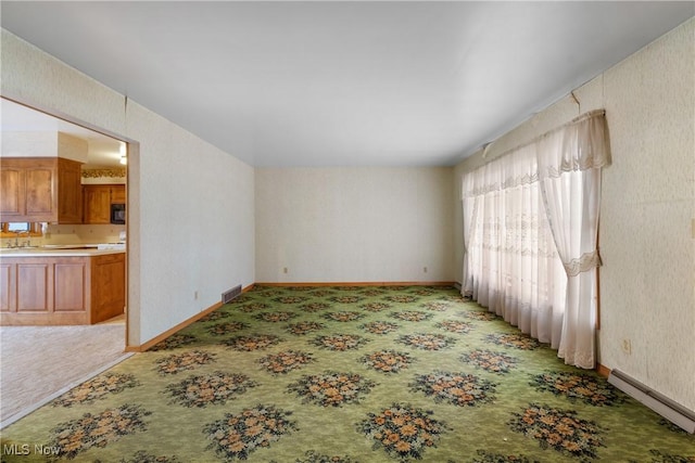 interior space featuring a baseboard heating unit and sink