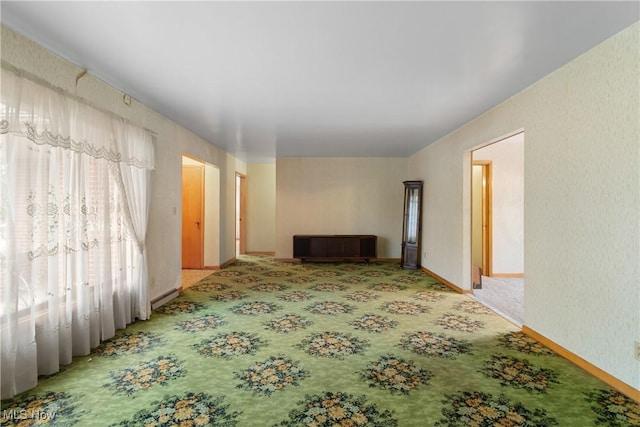 unfurnished living room featuring carpet flooring