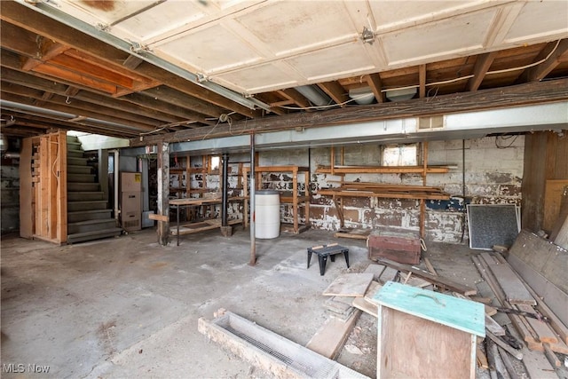 misc room featuring heating unit and concrete floors