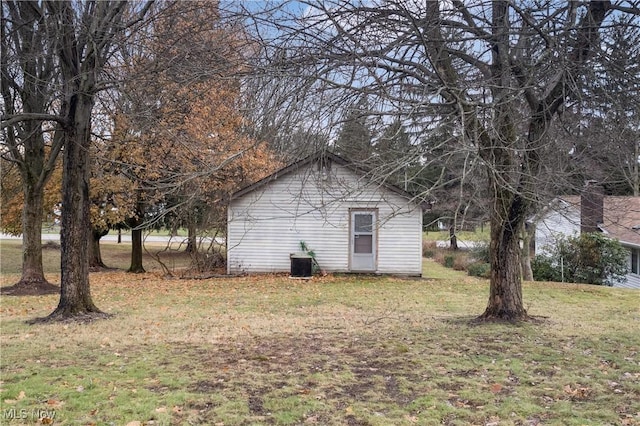 exterior space featuring a lawn and cooling unit