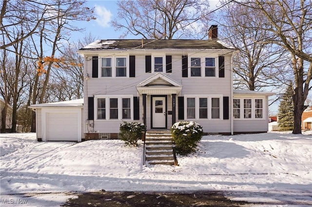 colonial inspired home featuring a garage