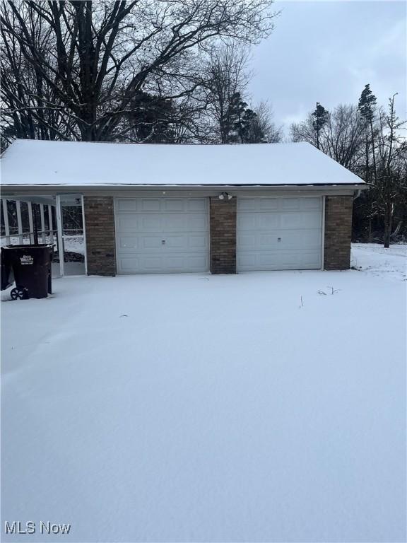 view of snow covered garage