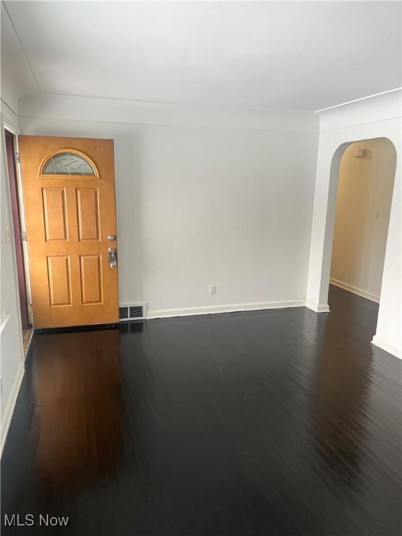 foyer with dark hardwood / wood-style flooring