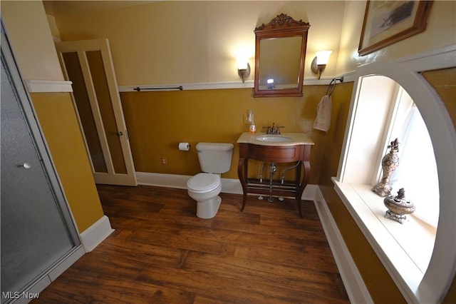 bathroom with hardwood / wood-style flooring, vanity, and toilet