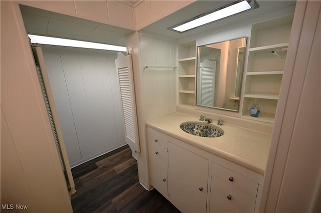 bathroom featuring hardwood / wood-style floors and vanity