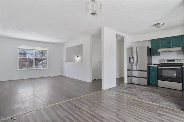 unfurnished living room featuring a textured ceiling, hardwood / wood-style flooring, and a notable chandelier