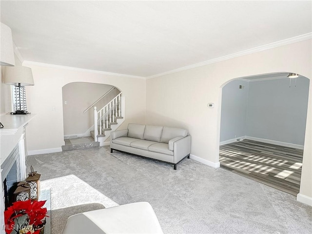 carpeted living room featuring crown molding