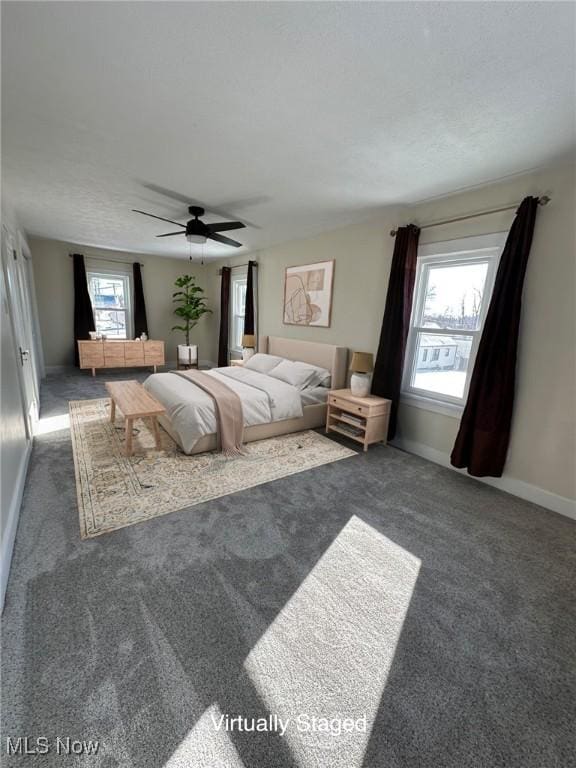 carpeted bedroom with ceiling fan