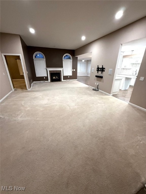 unfurnished living room with carpet flooring