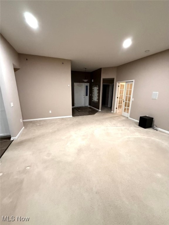 unfurnished living room with carpet flooring