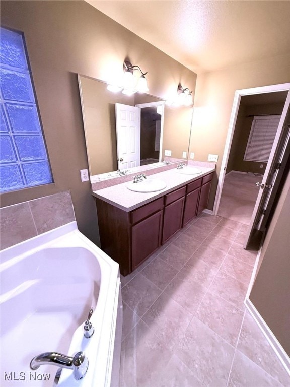 bathroom featuring vanity and a bathtub