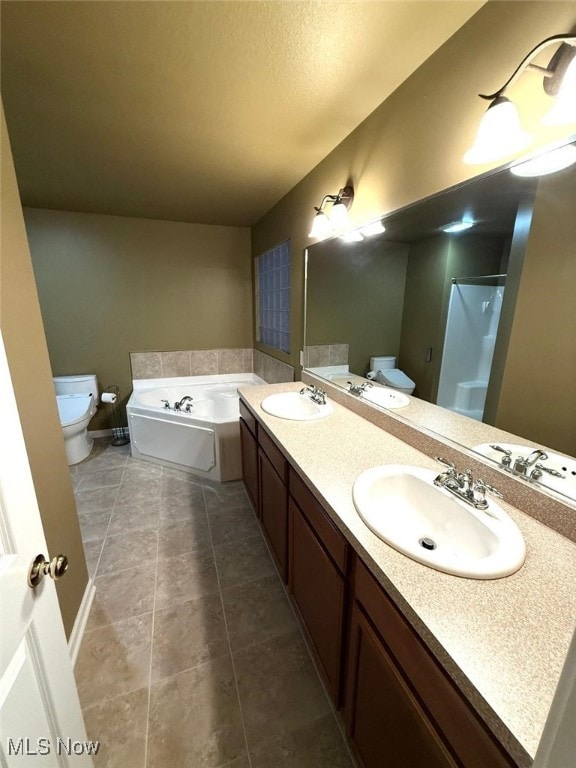 full bathroom with tile patterned flooring, vanity, toilet, and independent shower and bath