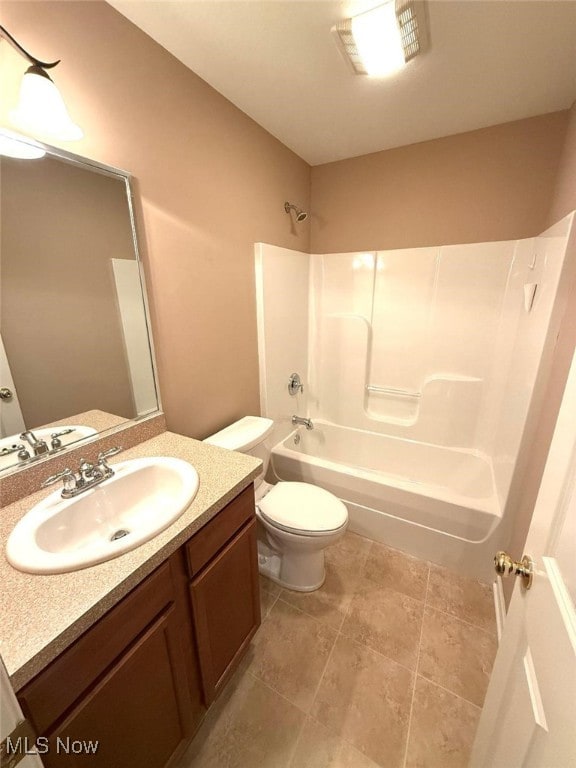 full bathroom with vanity, shower / bath combination, and toilet