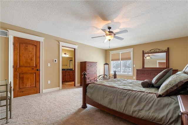 bedroom with light carpet, a textured ceiling, connected bathroom, and ceiling fan