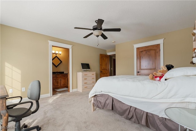 carpeted bedroom with connected bathroom and ceiling fan