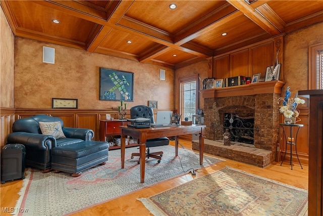 home office featuring coffered ceiling, wood ceiling, crown molding, light hardwood / wood-style flooring, and beamed ceiling