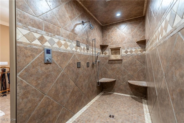 bathroom with a tile shower