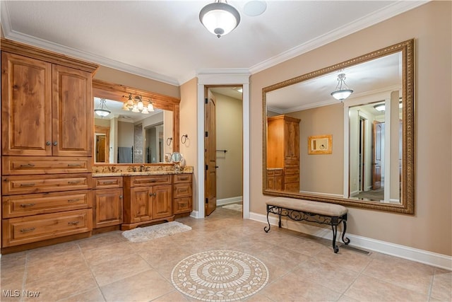 bathroom with vanity, tile patterned floors, and ornamental molding