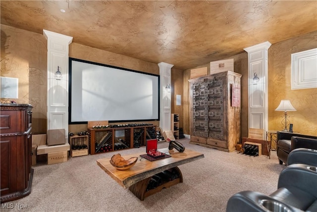 carpeted home theater with ornate columns