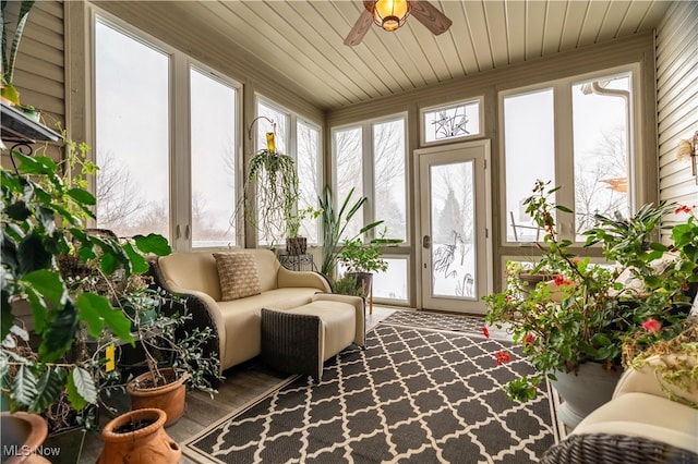 sunroom / solarium featuring ceiling fan