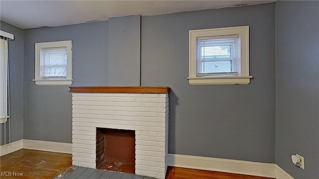 room details with hardwood / wood-style flooring and a brick fireplace