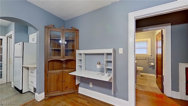 office space with light hardwood / wood-style floors