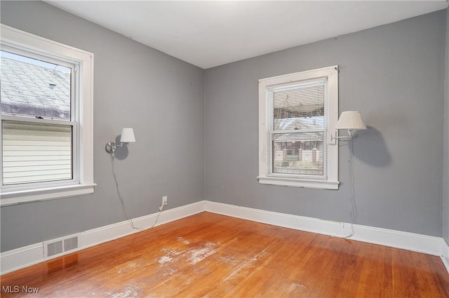 empty room with wood-type flooring