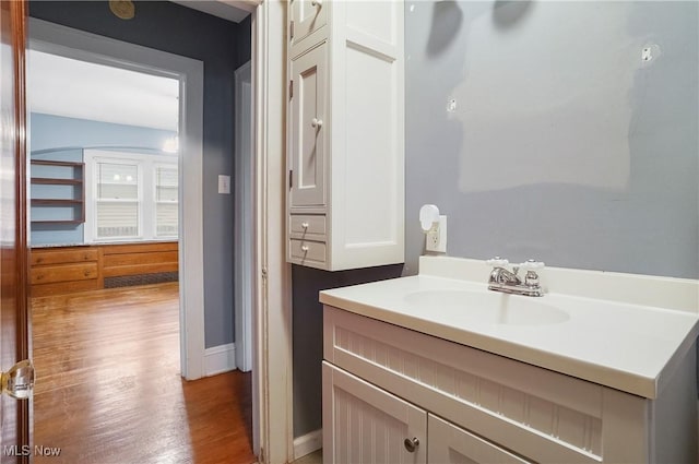 bathroom featuring vanity and hardwood / wood-style flooring