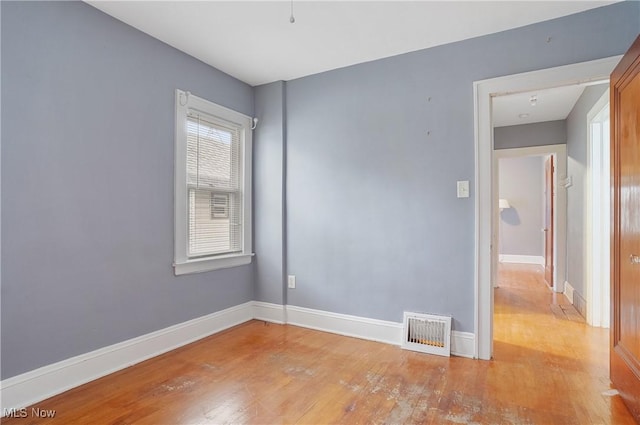 spare room featuring light hardwood / wood-style floors