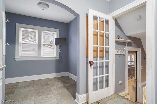 entryway featuring lofted ceiling